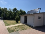 # Tolles Wohngefühl in zentraler Lage mit 2 TG-Stellplätzen! - Müllhäuschen mit Solar f. WW